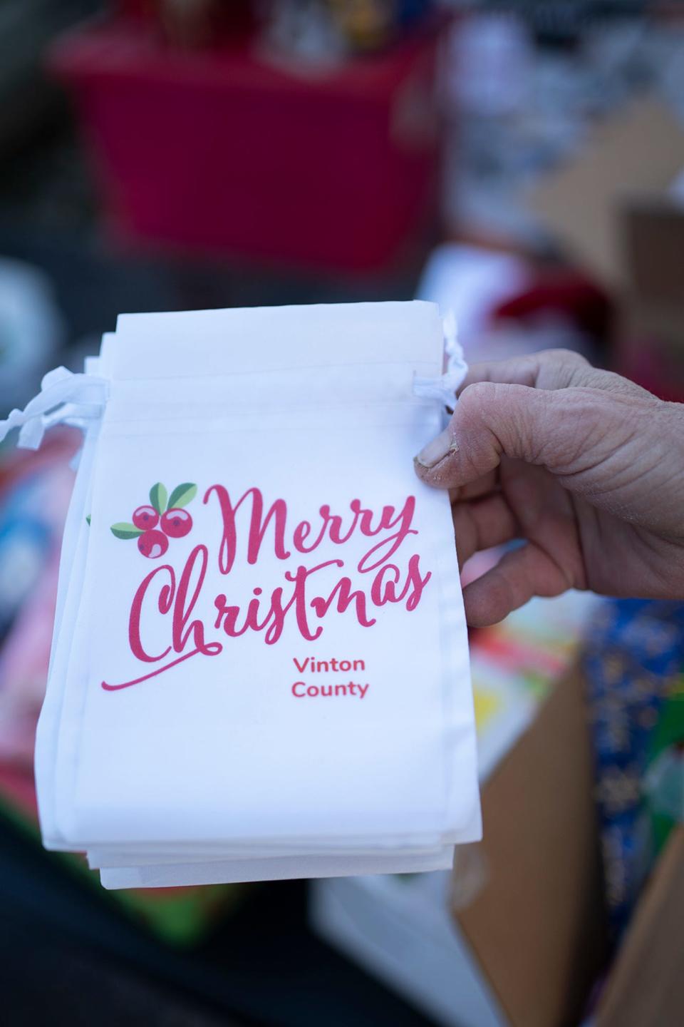 Sharon Bonazzo of Clintonville hauls out gifts, organized by gender and age, as she gets ready for a truck to pick them up. "We're onto our fourth truckload this year," she said. "I upped it during the pandemic."