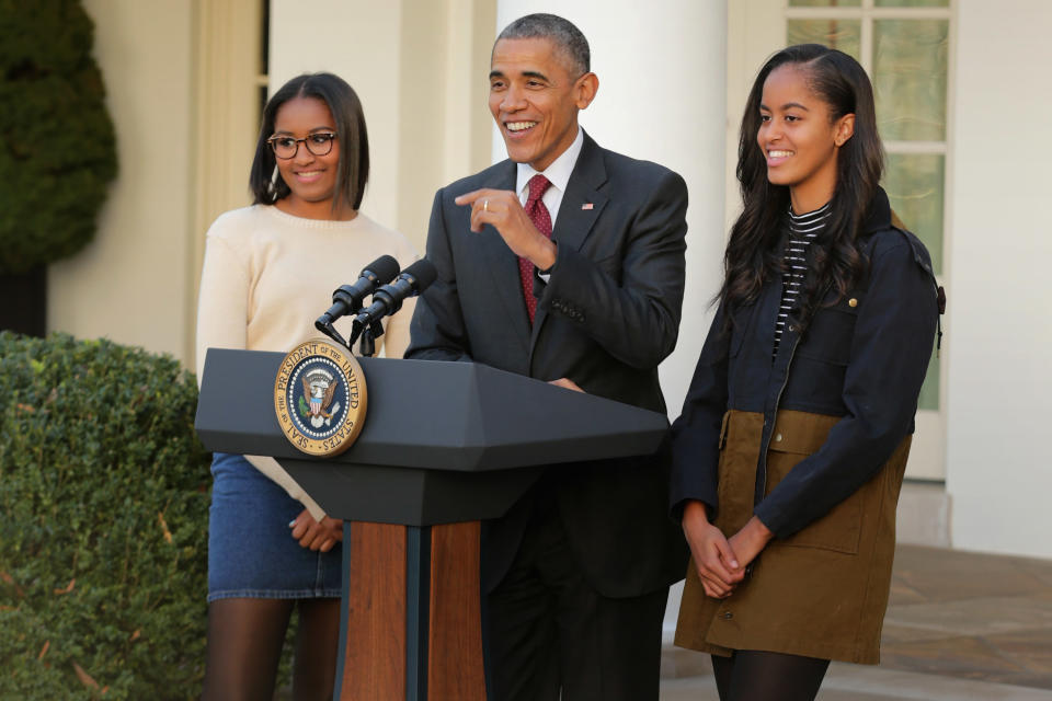 Sasha and Malia with their father Barack Obama. (Photo: Getty Images)