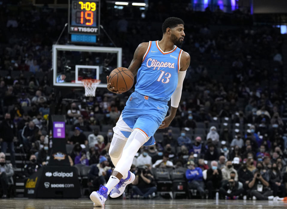 SACRAMENTO, CALIFORNIA - DECEMBER 22: Paul George #13 of the LA Clippers dribbles the ball against the Sacramento Kings during the second quarter at Golden 1 Center on December 22, 2021 in Sacramento, California. NOTE TO USER: User expressly acknowledges and agrees that, by downloading and or using this photograph, User is consenting to the terms and conditions of the Getty Images License Agreement. (Photo by Thearon W. Henderson/Getty Images)