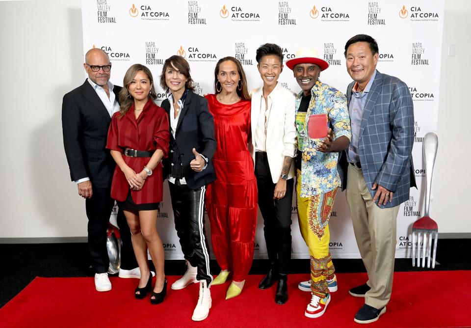 NAPA, CALIFORNIA - JUNE 15: (L-R) Co-host Alton Brown, Chefs Esther Choi, Dominique Crenn and Gabriela Cámara, Co-host Kristen Kish, and Chefs Marcus Samuelsson and Ming Tsai attend a screening, Q&amp;A and dinner for Netflix's Iron Chef: Quest for an Iron Legend hosted by Napa Valley Film Festival and the Culinary Institute of America at Copia on June 15, 2022 in Napa, California. (Photo by Kelly Sullivan/Getty Images for Netflix)