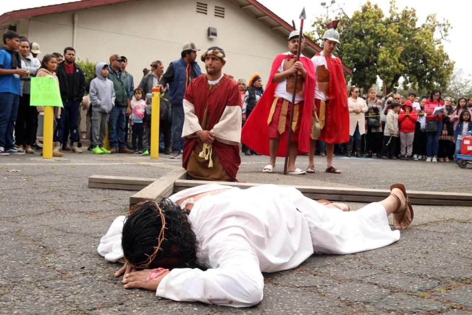 Luis Alberto Hernández as Jesús with other members of the church’s Recollection young adult group during the Live Stations of the Cross at Saint Anthony Mary Claret Catholic church on Good Friday, March 29, 2024, in Fresno.