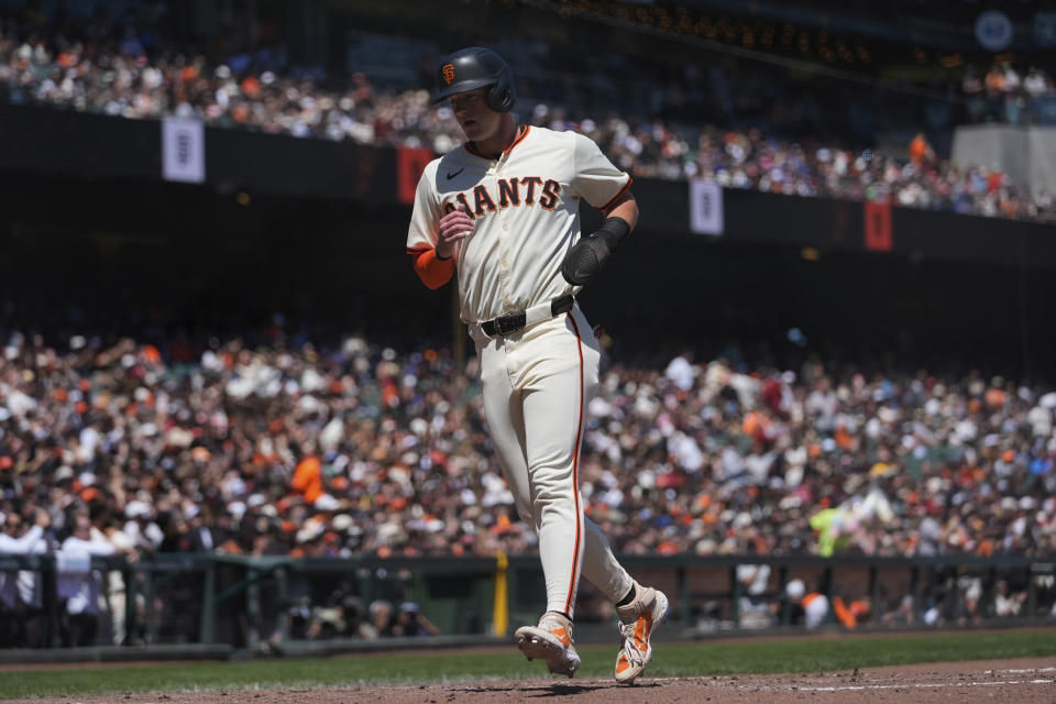 San Francisco Giants' Tyler Fitzgerald scores against the Pittsburgh Pirates on a sacrifice fly by teammate LaMonte Wade Jr. during the third inning of a baseball game Sunday, April 28, 2024, in San Francisco. (AP Photo/Godofredo A. Vásquez)