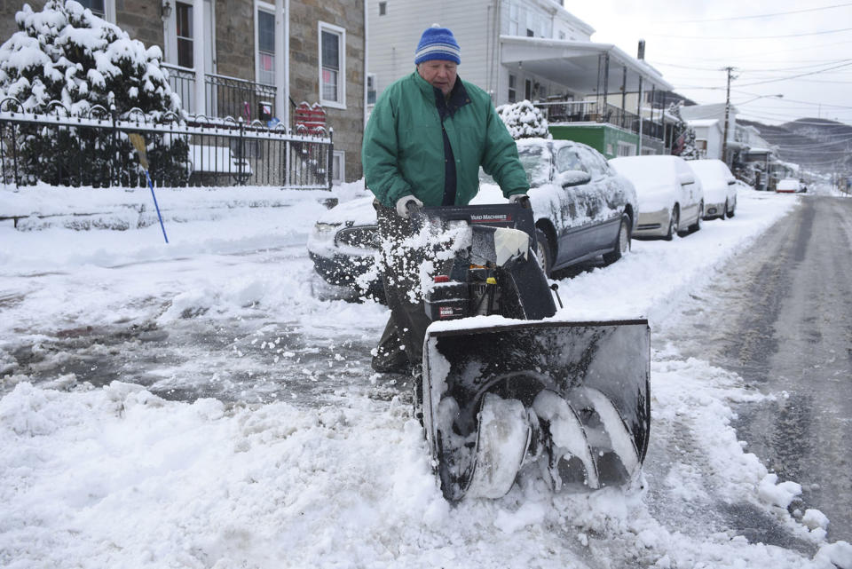 <p>William Rutecky clears a spot in front of his home after a snowstorm in Palo Alto, Pa., on Thursday, Feb. 9, 2017. (Photo: Jacqueline Dormer/The Republican-Herald via AP) </p>