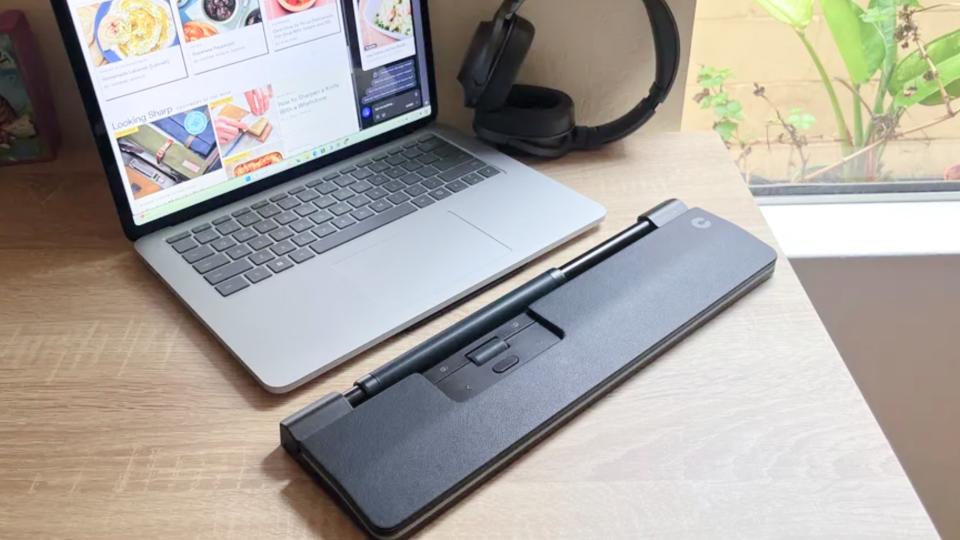 Contour Rollermouse Pro Slim on a desk in front of a laptop