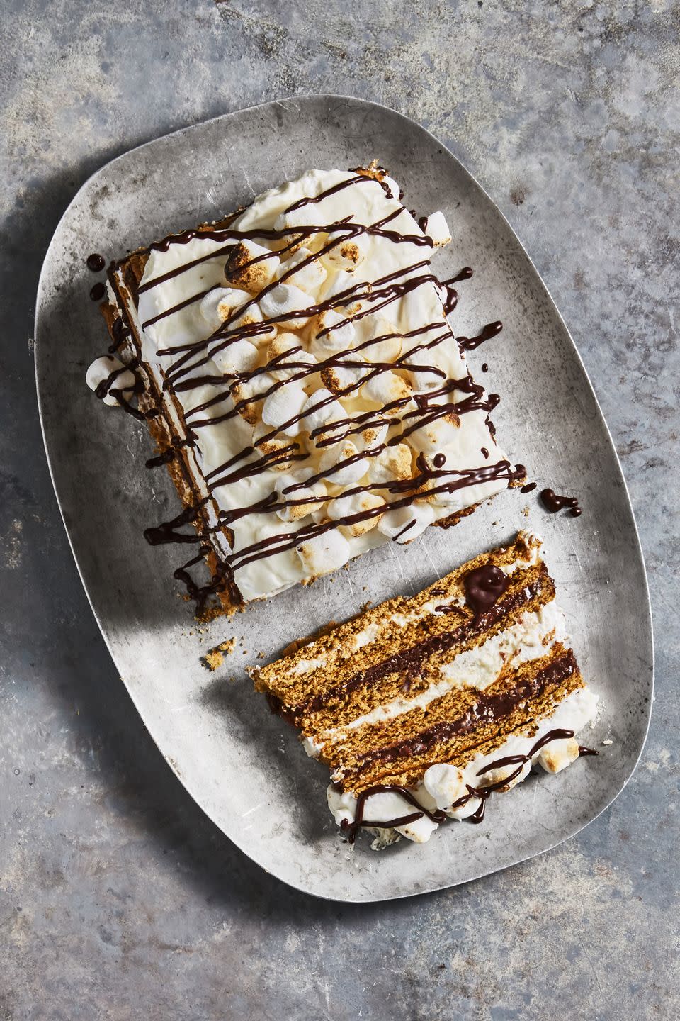 <p>To Mom's delight, there's no post-campfire cleanup necessary. This cake is entirely no-bake. </p><p>Get the <a href="https://www.goodhousekeeping.com/food-recipes/dessert/a45720/smores-icebox-cake-recipe/" rel="nofollow noopener" target="_blank" data-ylk="slk:S'mores Icebox Cake recipe;elm:context_link;itc:0;sec:content-canvas" class="link "><strong>S'mores Icebox Cake recipe</strong></a><em>.</em></p>