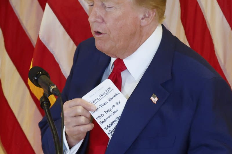 Former President Donald Trump pulls out a note card when he arrives to speak at a press conference at Trump Tower after getting a guilty verdict. The former president was found guilty in May by a jury of his peers on all 34 counts against him in his New York hush-money trial. Photo by John Angelillo/UPI