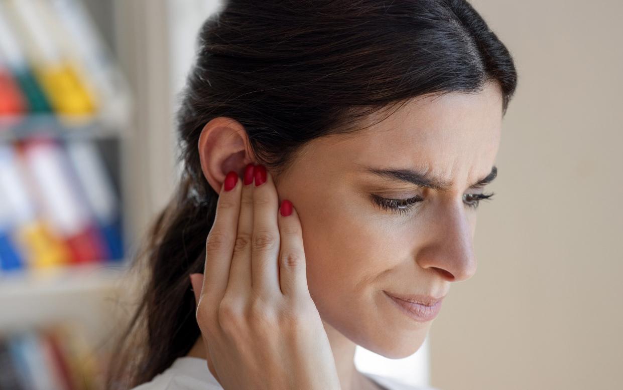 A woman struggling to hear - Most effective way to treat sudden hearing loss revealed