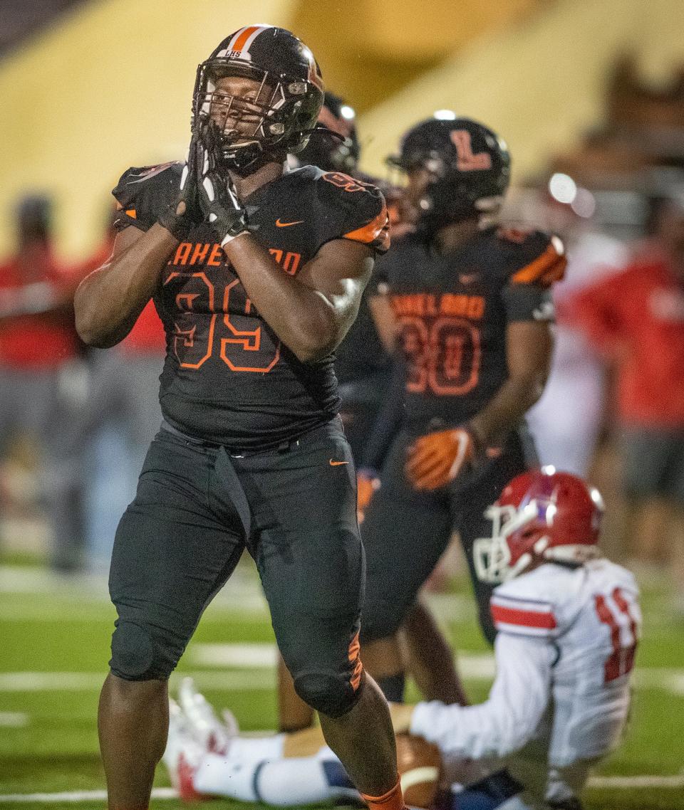 Lakeland Dreadnaughts (99) Gabriel Dindy celebrates a sack of Manatee High School quarterback (11) Jayse Berzowski in first half action at Bryant Stadium in Lakeland  Fl. Friday Sept. 3 2021.  ERNST PETERS/ THE LEDGER