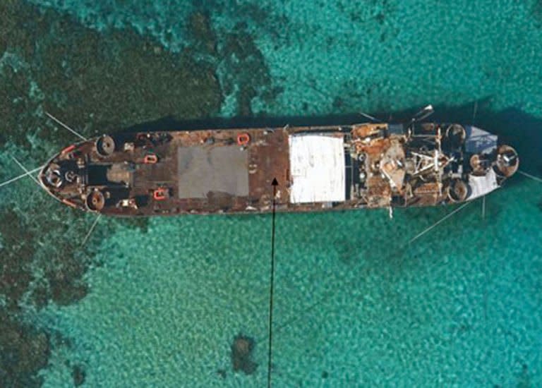 An aerial view of BRP Sierra Madre, a 100-metre ship built for the US in 1944, grounded at Second Thomas Shoal in the Spratly Islands. The Philippines vowed Thursday to "defend what is ours" as part of a stand-off over a Chinese warship circling the South China Sea reef which is occupied by Filipino marines