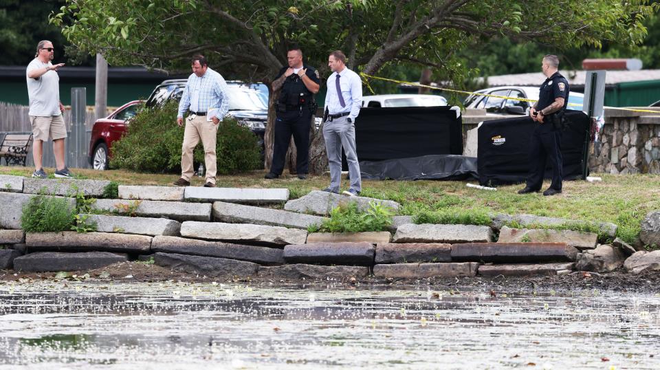 Police investigate after a body was pulled from Upper Porter Pond at D.W. Field Park in Brockton, on Sunday, Aug. 14, 2022.