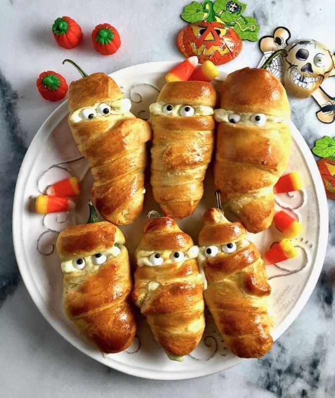 <p>Grits and Pinecones</p><p><strong>These mummified jalapeno popper easy Halloween appetizer that's equal parts spicy, satisfying, and adorably spooky. </strong></p><p><strong>Get the recipe: <a href="https://www.gritsandpinecones.com/easy-halloween-jalapeno-mummies/" rel="nofollow noopener" target="_blank" data-ylk="slk:Easy Halloween Jalapeno Mummies;elm:context_link;itc:0;sec:content-canvas" class="link ">Easy Halloween Jalapeno Mummies</a></strong></p>