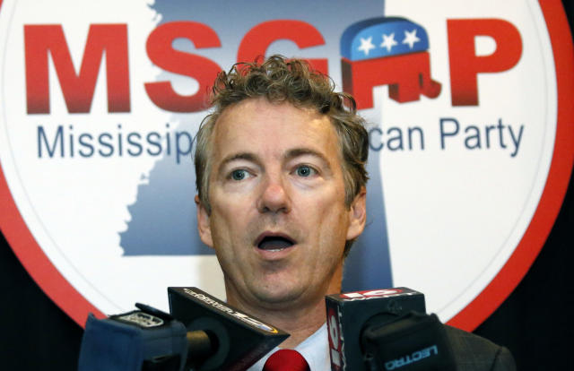 U.S. Sen. Rand Paul, R-Ky., speaks with reporters Monday, Dec. 8, 2014 in Jackson, Miss. (AP Photo/Rogelio V. Solis)