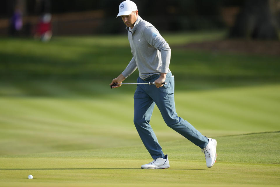 Jordan Spieth watches his putt on the 11th green drop into the hole during the second round of the Players Championship golf tournament Friday, March 10, 2023, in Ponte Vedra Beach, Fla. (AP Photo/Charlie Neibergall)