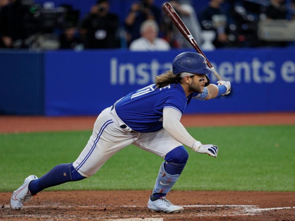Blue Jays shortstop Bo Bichette prepares to leave home plate after connecting with a pitch during Toronto’s last regular season series against the New York Yankees, at Rogers Centre on Sept. 28, 2022. (Evan Mitsui/CBC - image credit)