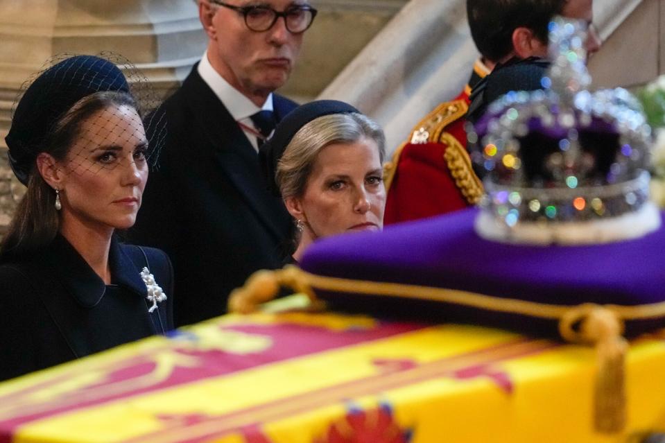 Catherine, Princess of Wales and Sophie, Countess of Wessex watch the coffin of Queen Elizabeth II, adorned with a Royal Standard and the Imperial State Crown, arriving at Westminster Hall on September 14, 2022 in London, United Kingdom. Queen Elizabeth II's coffin is taken in procession on a Gun Carriage of The King's Troop Royal Horse Artillery from Buckingham Palace to Westminster Hall where she will lay in state until the early morning of her funeral. Queen Elizabeth II died at Balmoral Castle in Scotland on September 8, 2022, and is succeeded by her eldest son, King Charles III.