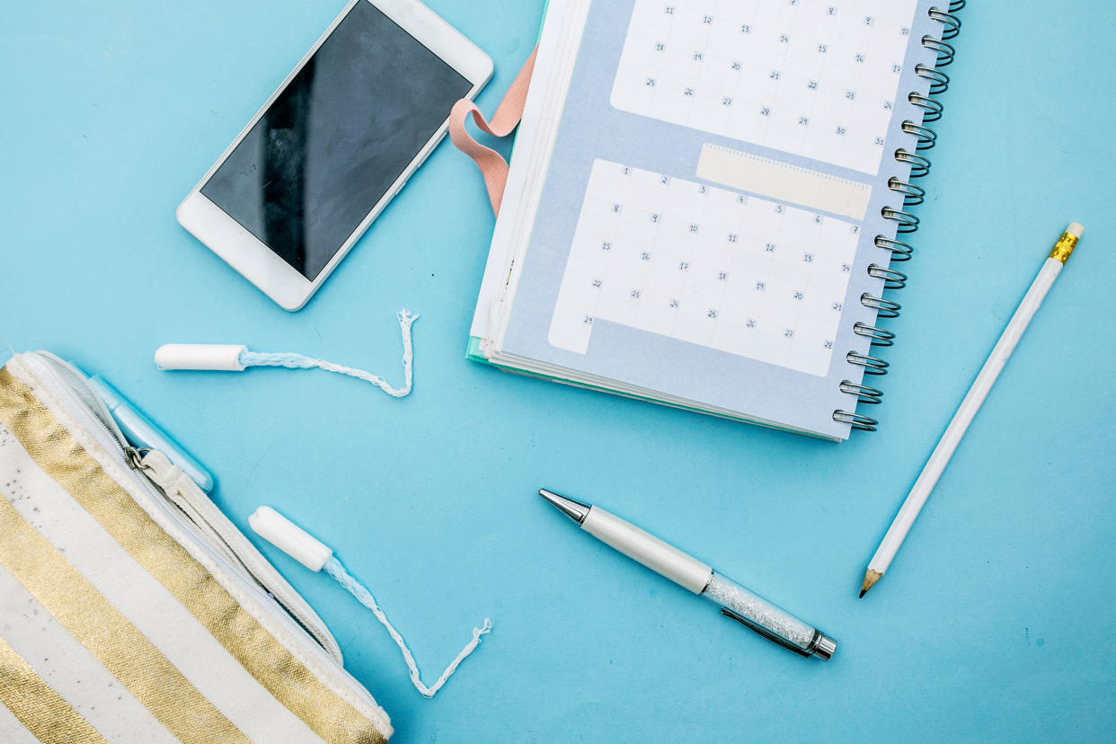 Tampon and Calendar in blue background