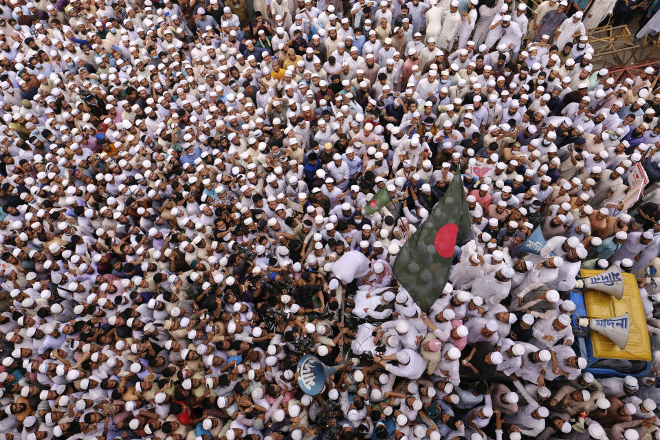 Thousands of Bangladeshi Muslims protesting the French president’s support of secular laws allowing caricatures of the Prophet Muhammad march to lay siege on the French Embassy in Dhaka, Bangladesh, Monday, Nov.2, 2020. (AP Photo/Mahmud Hossain Opu)