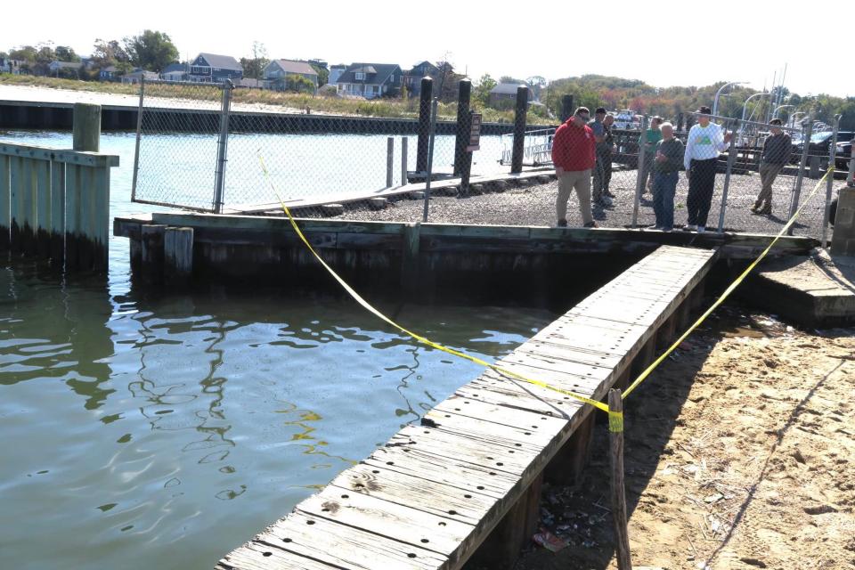 Middletown personnel and marine mammal experts gather at Leonardo State Park, where a dead minke whale was trapped between a bulkhead and breakwater on Oct. 19, 2023.