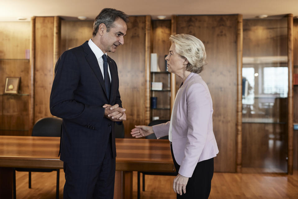 In this photo provided by the Greek Prime Minister's Office, Greece's Prime Minister Kyriakos Mitsotakis, left, and EU Commission President Ursula von der talk during their meeting in Strasbourg, France, Tuesday, Sept. 12, 2023. The European Union is promising Greece more than 2 billion euros ($2.15 billion) in financial support in the wake of massive summer wildfires and ongoing floods that have caused extensive damage across central Greece. (Dimitris Papamitsos/Greek Prime Minister's Office via AP)