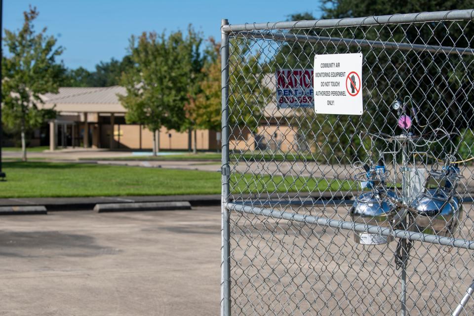 An EPA air monitoring device sits in the parking lot of the 5th Ward Elementary School, just down the street from the Denka Performance Elastomer neoprene plant in Reserve, La. The EPA classified chloroprene as a likely carcinogen in 2010 and has been closely monitoring air quality near the plant since 2016.
