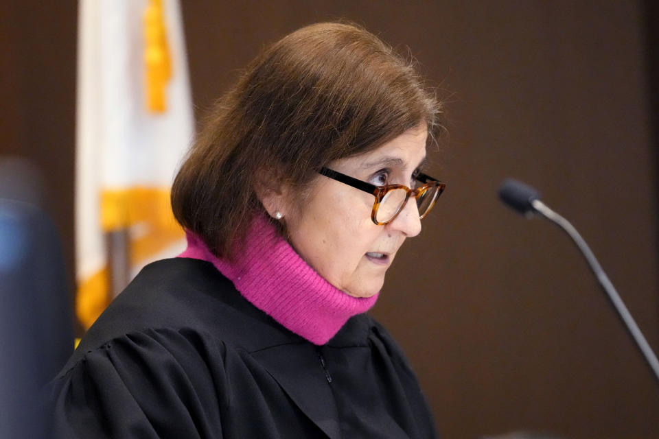 Judge Victoria A. Rossetti asks questions to Robert E. Crimo III., during a case management conference at the Lake County Courthouse Friday, Jan. 5, 2024, in Waukegan, Ill. A case management conference is scheduled for a suspect in a mass shooting that left seven people dead during a July 4 parade in Highland Park, Illinois. (AP Photo/Nam Y. Huh, Pool)