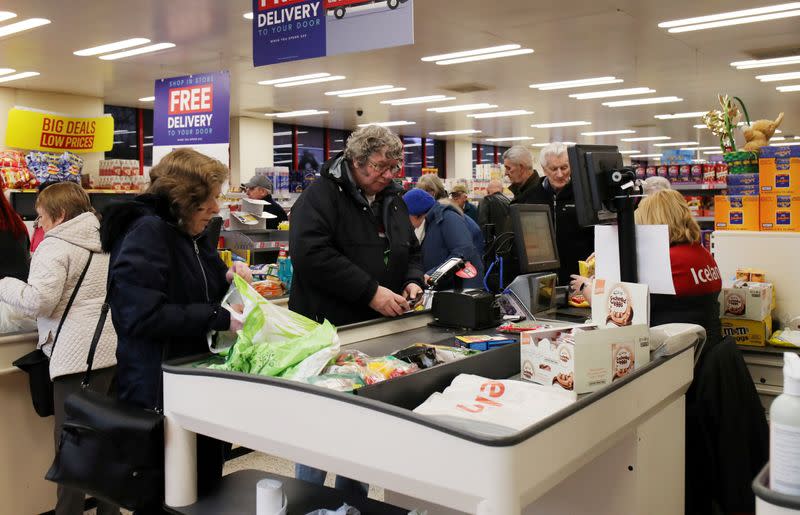 FILE PHOTO: People at an Iceland store in Northwich after opening one hour early