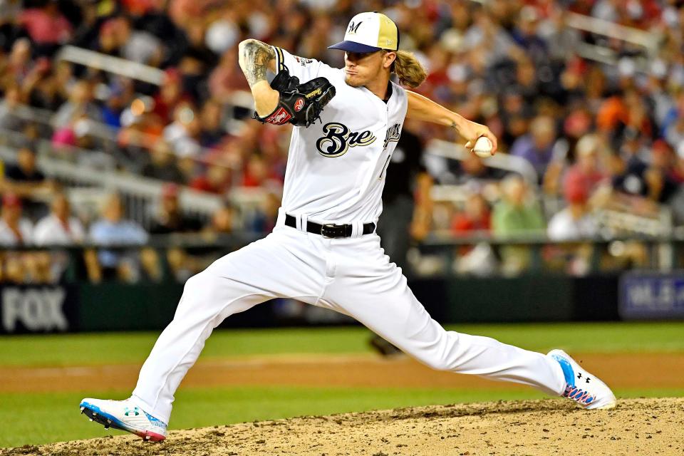 Josh Hader of the Brewers pitches in the eighth inning.