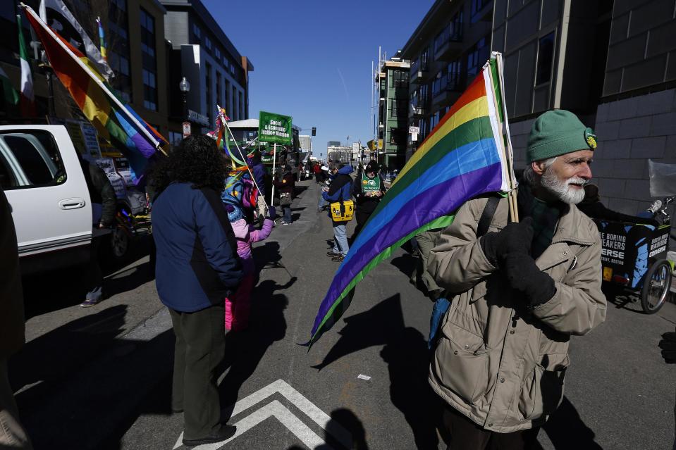 Gay rights advocates prepare to march in an equality parade immediately after the annual South Boston St. Patrick's Day parade in Boston, Massachusetts March 16, 2014. Boston's Irish-American mayor skipped the parade on Sunday after failing to hammer out a deal with organizers to allow a group of gay and lesbian activists to march openly. REUTERS/Dominick Reuter (UNITED STATES - Tags: ANNIVERSARY TRAVEL SOCIETY)