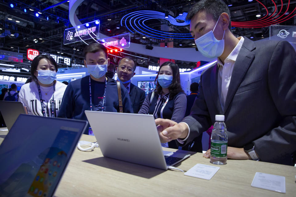 People view laptop computers from Chinese tech firm Huawei at the PT Expo in Beijing, Wednesday, Sept. 14, 2020. China's leaders vowed Thursday, Oct. 29, 2020 to speed up its development as a self-reliant "technology power" amid a feud with Washington that is cutting access to U.S. components and hampering Beijing's industrial ambitions. (AP Photo/Mark Schiefelbein)