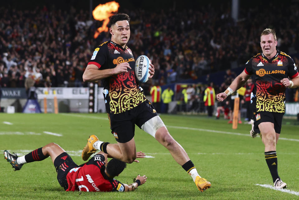 Shaun Stevenson of the Chiefs runs in to score a try during the Super Rugby Pacific final between the Chiefs and the Crusaders in Hamilton, New Zealand, Saturday, June 24, 2023. (Aaron Gillions/Photosport via AP)