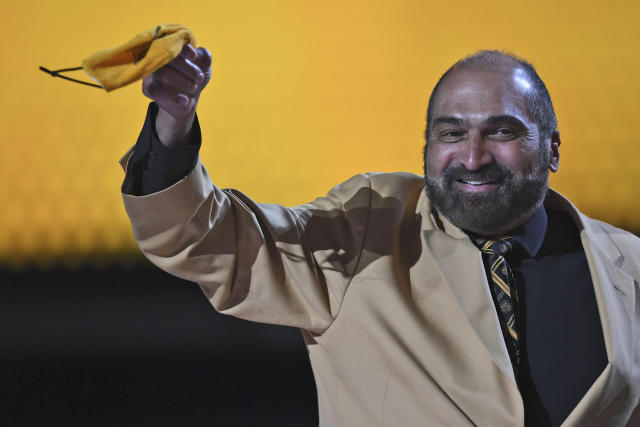 FILE - NFL Hall of Famer Franco Harris waves a terrible towel mask during the second round of the NFL football draft Friday, April 30, 2021, in Cleveland. Franco Harris, the Hall of Fame running back whose heads-up thinking authored “The Immaculate Reception,” considered the most iconic play in NFL history, died Wednesday, Dec. 21, 2022. He was 72. (AP Photo/David Dermer, File)