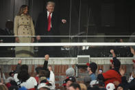 Former President Donald Trump and his wife Melania arrive for Game 4 of baseball's World Series between the Houston Astros and the Atlanta Braves Saturday, Oct. 30, 2021, in Atlanta. (AP Photo/David J. Phillip)