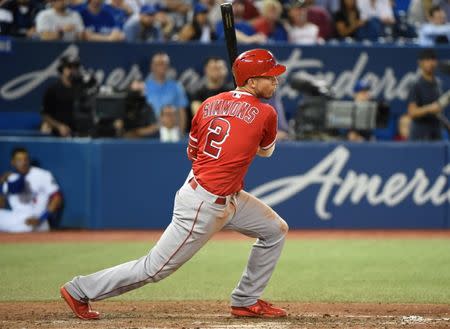 May 23, 2018; Toronto, Ontario, CAN; Los Angeles Angels shortstop Andrelton Simmons (2) hits a two run RBI single against Toronto Blue Jays in the ninth inning at Rogers Centre. Mandatory Credit: Dan Hamilton-USA TODAY Sports