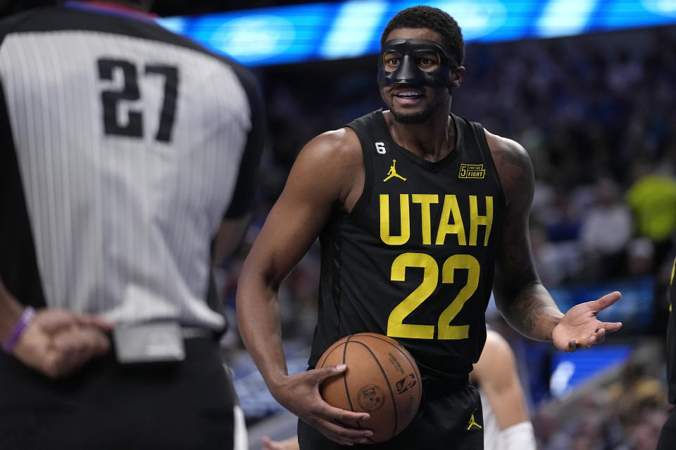 Utah Jazz forward Rudy Gay (22) look to referee Mitchell Ervin (27) after a call against his team in the first half of an NBA basketball game against the Dallas Mavericks, Tuesday, March 7, 2023, in Dallas. (AP Photo/Tony Gutierrez)