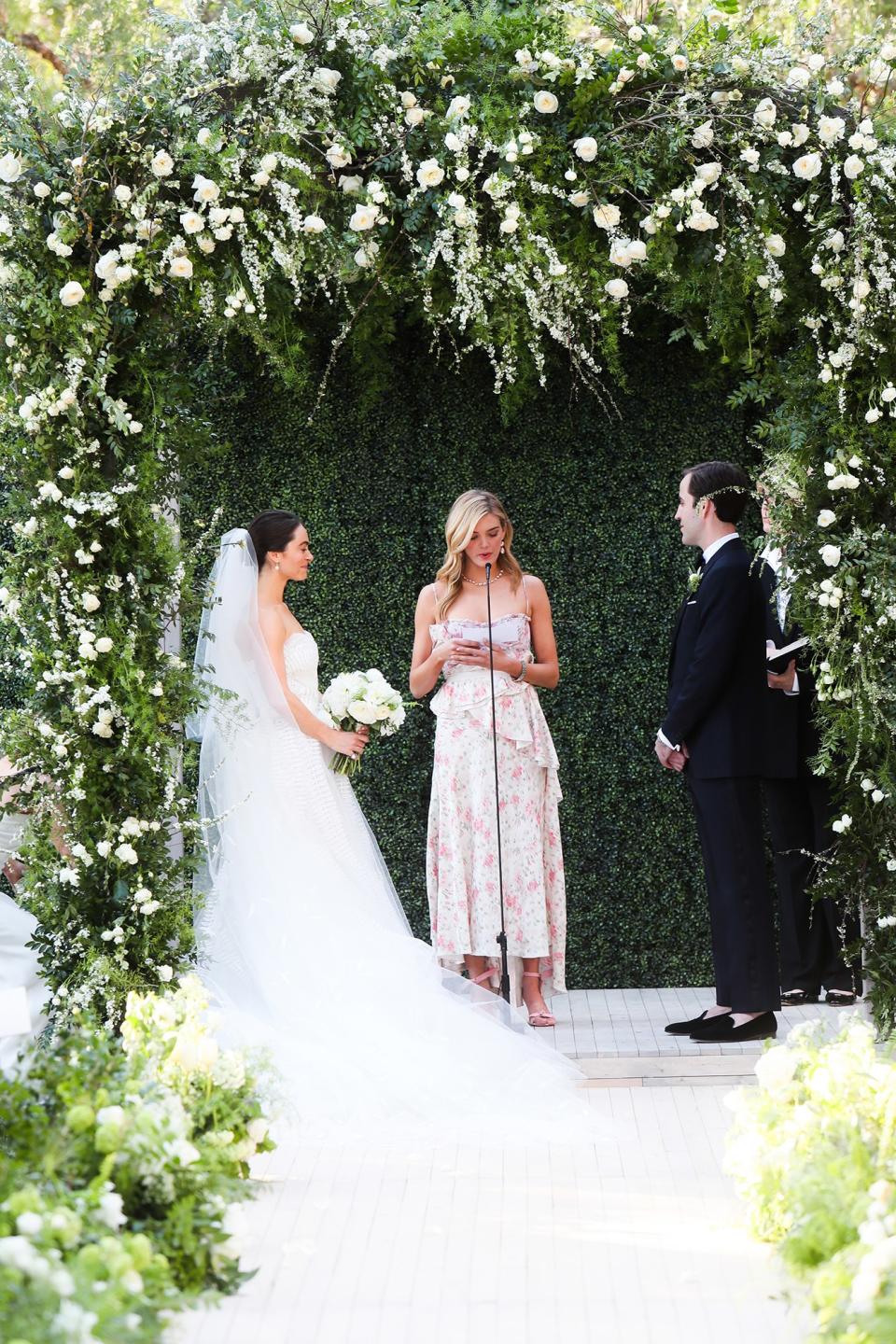 The bride wore Oscar de la Renta, inspired by her grandmother, for her greenery-filled ceremony at the Beverly Hills Hotel.