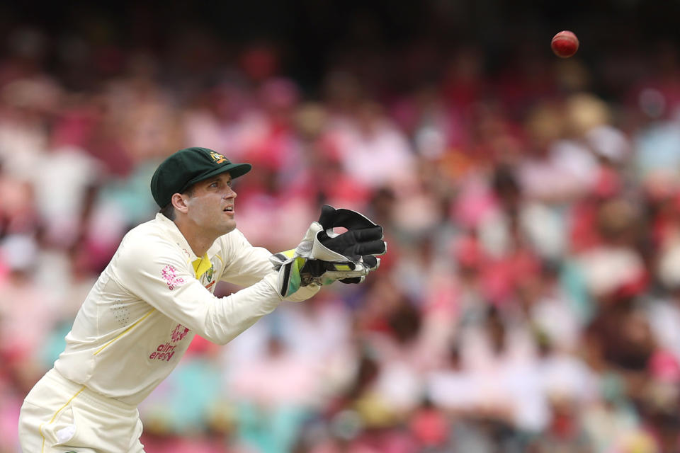 Pictured here, Australian wicketkeeper Alex Carey prepares to catch a ball during the fourth Ashes Test at the SCG.