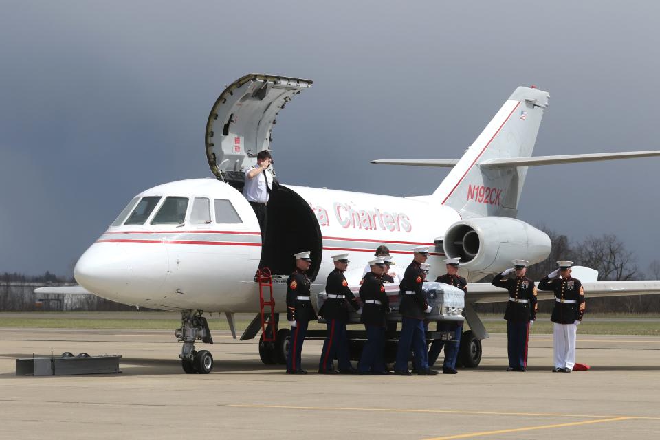 The casket bearing Marine Corps Gunnery Sgt. James Speedy arrived at Zanesville Municipal Airport on Friday. Speedy was killed during a training exercise in Norway last month. 