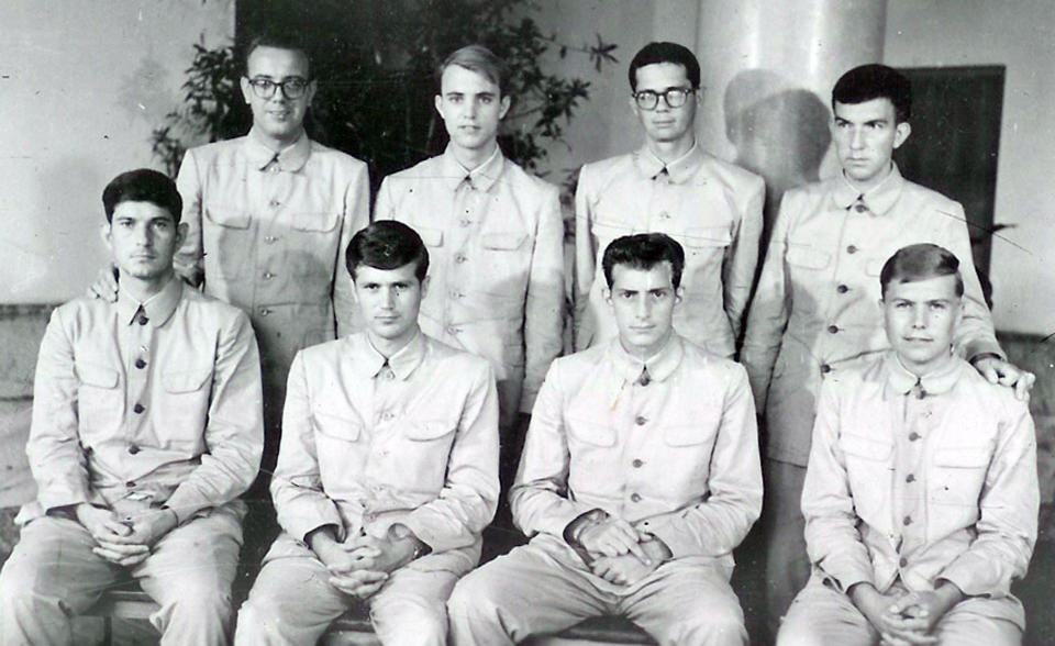 In this photo released by the U.S. Navy, crew members of USS Pueblo pose while in captivity in North Korea in 1968.  / Credit: AP Photo/US Navy