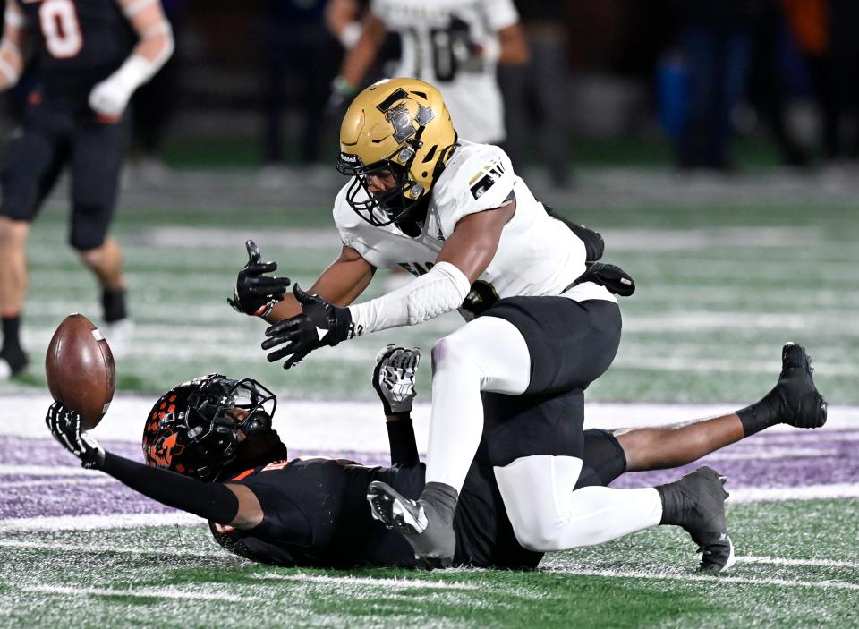 Abilene High wide receiver Ryland Bradford chases the ball after the deep pass meant for him was broken up by Aledo center back Chris Johnson during Friday’s Region I-5A Div. I final in Stephenville.