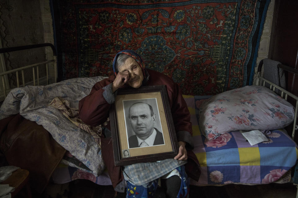 <span class="s1">Natalia Reshetnyakova, age 83, holds a portrait of her late husband, to whom she was married to for over 50 years. She lives alone now in Katerinovka, Lugansk. The only thing left reminding her of her husband is this portrait. Fewer than 300 people live in Natalia’s village, which is exposed to sniper fire as the contact line is nearby. (Photograph by Paula Bronstein)</span>