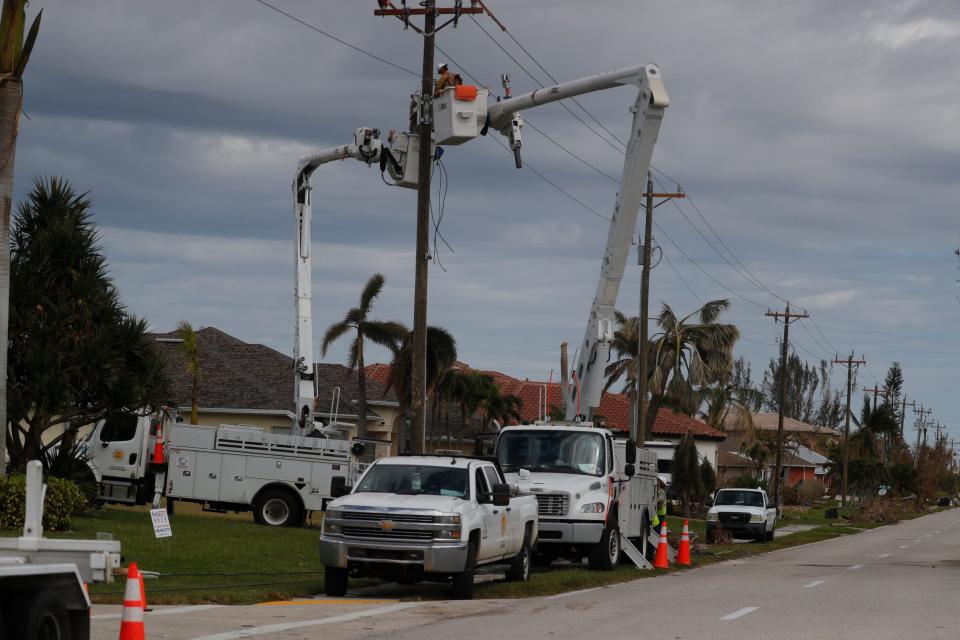 Line crews continue to work along Agualinda Boulevard to restore power to area residents in Cape Coral Sunday, Oct. 9, 2022. Many people continue to struggle without power at their homes after impact from Hurricane Ian.