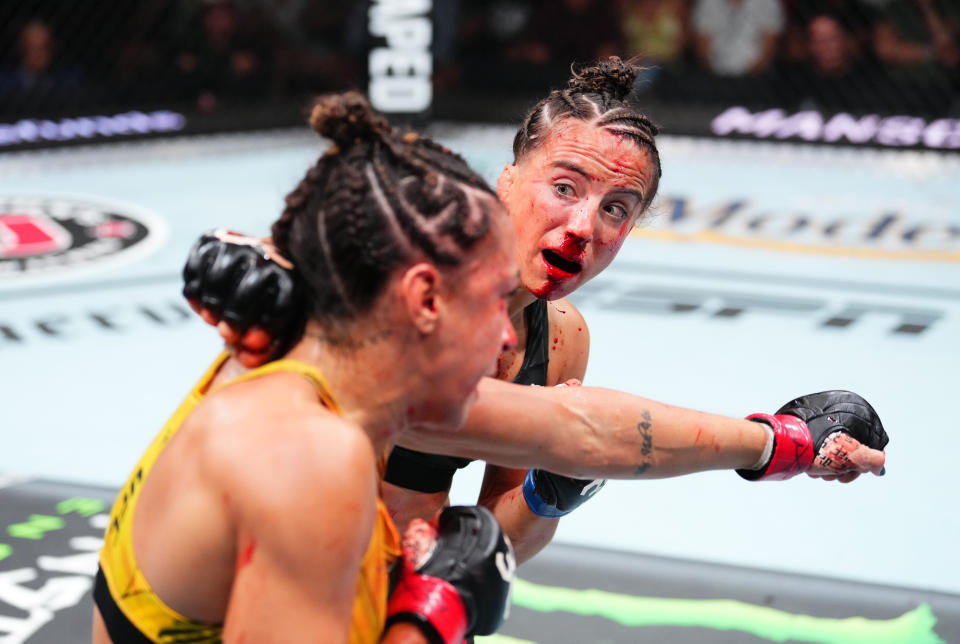 JACKSONVILLE, FLORIDA - JUNE 24:  (R-L) Maycee Barber punchess Amanda Ribas of Brazil in their women's flyweight fight during the UFC Fight Night event at Vystar Veterans Memorial Arena on June 24, 2023 in Jacksonville, Florida. (Photo by Josh Hedges/Zuffa LLC)