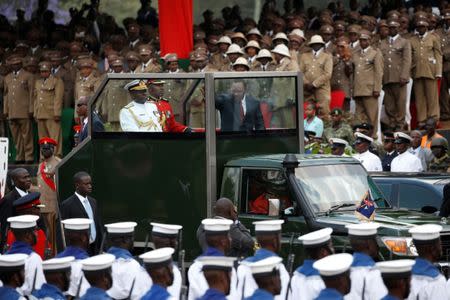 Kenya's President Uhuru Kenyatta wave as he arrives for the country's Mashujaa Day (Heroes' Day) celebrations at the Uhuru park in Nairobi, Kenya October 20, 2017. REUTERS/Baz Ratner