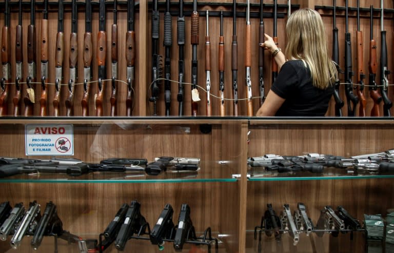 At a gun shop in Sao Paulo, Brazilian President Jair Bolsonaro's rollback of restrictions on gun ownership was welcomed, but not everyone believes it can stem the country's spiral of violence