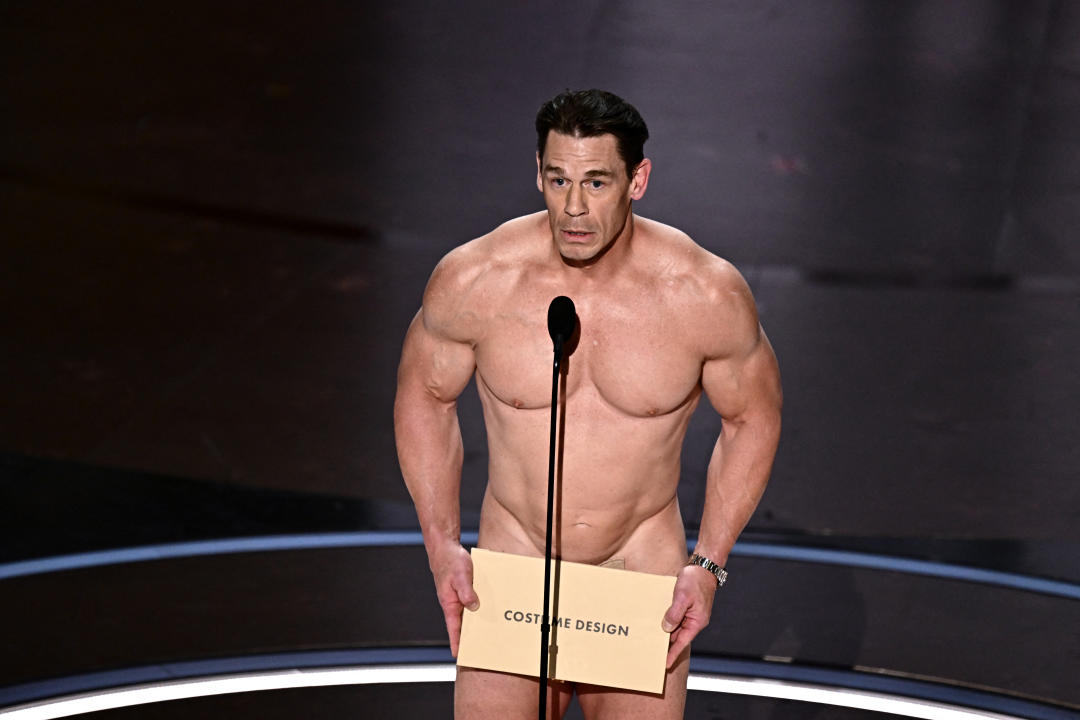 TOPSHOT - US actor John Cena presents the award for Best Costume Design onstage during the 96th Annual Academy Awards at the Dolby Theatre in Hollywood, California on March 10, 2024. (Photo by Patrick T. Fallon / AFP) (Photo by PATRICK T. FALLON/AFP via Getty Images)