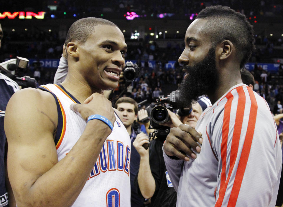 Oklahoma City Thunder guard Russell Westbrook (0) and Houston Rockets guard James Harden, right, talk after their NBA basketball game in Oklahoma City, Wednesday, Nov. 28, 2012. Oklahoma City won 120-98. (AP Photo/Sue Ogrocki)