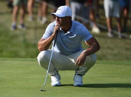 Aug 11, 2018; Saint Louis, MO, USA; Brooks Koepka lines up a putt on the 15th green during the third round of the PGA Championship golf tournament at Bellerive Country Club. Jeff Curry-USA TODAY Sports