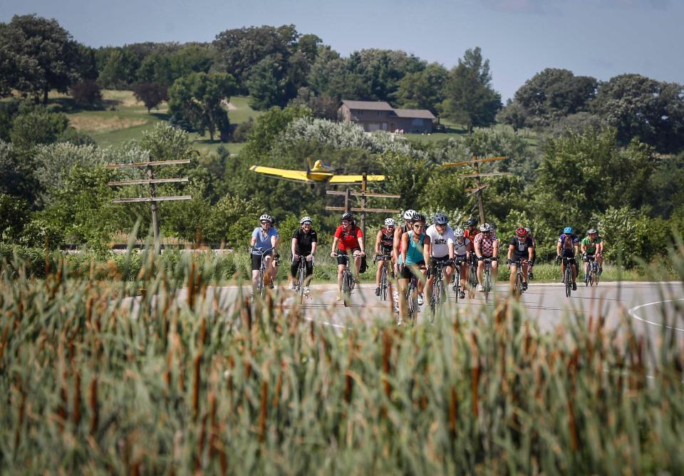 Iowa and nine other states have sued pesticide makers Syngenta and Corteva, alleging anti-competitive practices that have cost farmers millions of dollars. Here a crop dusting plane takes off as cyclists roll into Anita during RAGBRAI on Monday, July 22, 2019.
(Photo: Bryon Houlgrave, The Register)