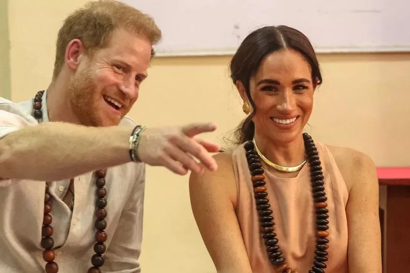 Prince Harry (L), Duke of Sussex, and Britain's Meghan (R), Duchess of Sussex