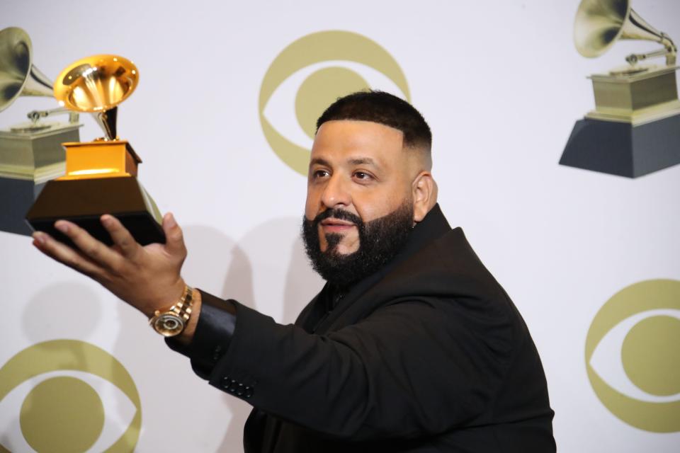 DJ Khaled poses with the award for best rap/sung collaboration for "Higher."